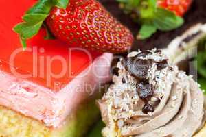 cake and strawberries lying on the orange fabric