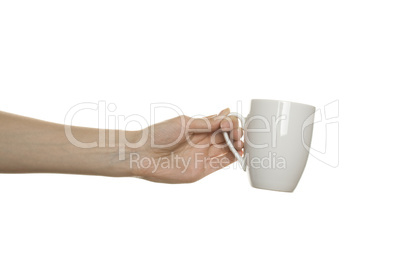 White cup in the female hand