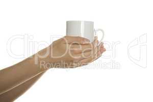 White cup in the female hands