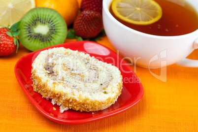 lemon,lemon tea,mandarin,kiwi,cake and strawberries lying on the