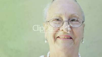 Old woman with white hair smiling