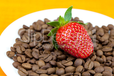 strawberries lying on a background of coffee beans