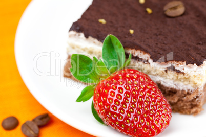 cake and strawberries lying on the orange fabric