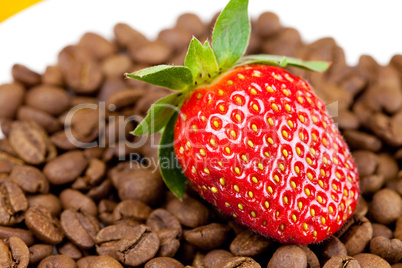 strawberries lying on a background of coffee beans