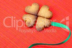 cookie  in the form of an Irish clover and green and green  on a