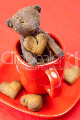 teddy bear  handmade and cookie  in the form of heart  in a cup