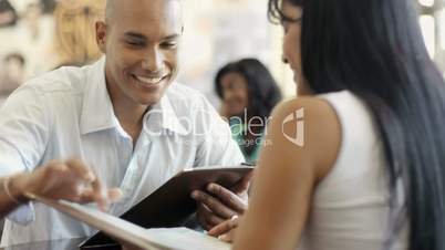 Young man and woman dining out in restaurant