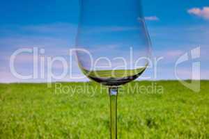 conceptually lighted wine glasson the background of the sky and