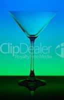 conceptually illuminated martini glass on gradient background