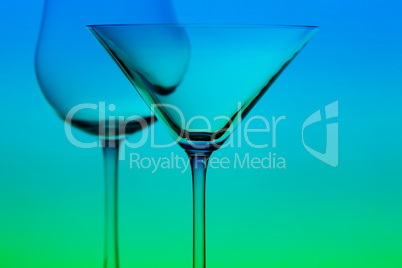 a conceptually illuminated glasses on gradient background