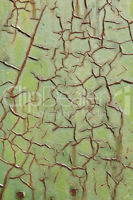 Texture of the old green paint on the metal