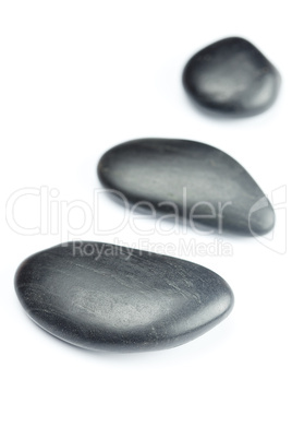 big black spa stones isolated on white