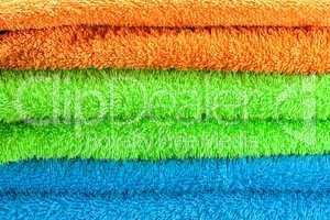 background of the three multi colored terry towels