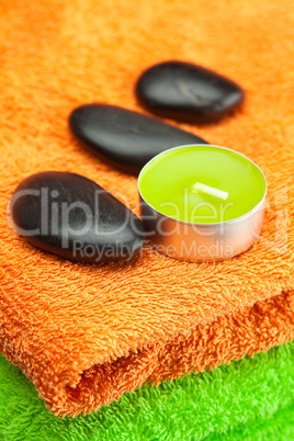 background of the three multi colored bath towels, spa black sto