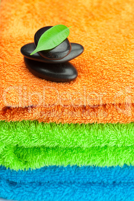 background of the three multi-colored terry towels and spa black