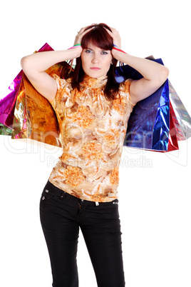 woman looking puzzled while choosing whilst shopping