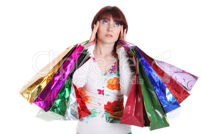 Beautiful happy woman with shopping bags isolated