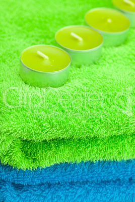 a few candles lying on the towel