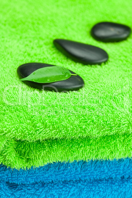 black spa stones lying on the towel