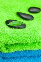black spa stones lying on the towel