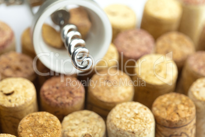 background of the mountains  of wine corks and a corkscrew