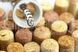 background of the mountains  of wine corks and a corkscrew