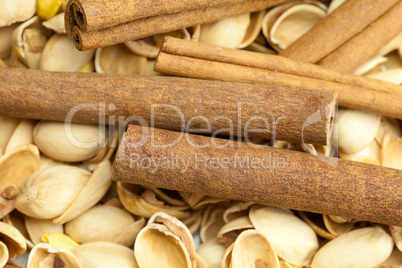 background from the shell of pistachio nuts and cinnamon sticks