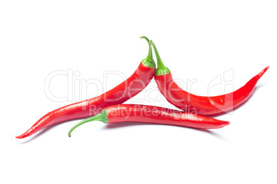 juicy red chili peppers isolated on white