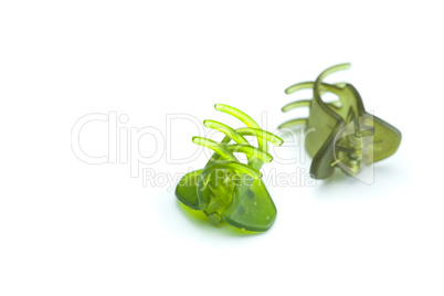 green hairpins isolated on white