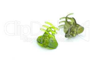 green hairpins isolated on white