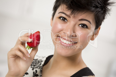 Pretty Hispanic Woman Holding Strawberry