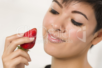 Pretty Hispanic Woman Holding Strawberry