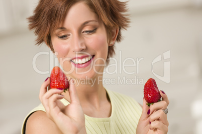 Pretty Red Haired Woman Holding Strawberry