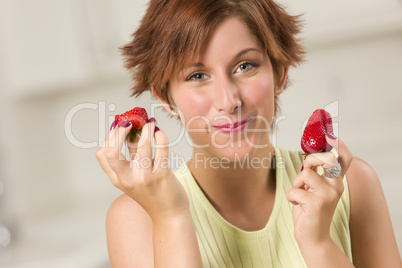 Pretty Red Haired Woman Eating Strawberry