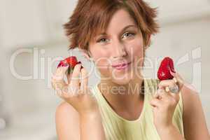 Pretty Red Haired Woman Eating Strawberry