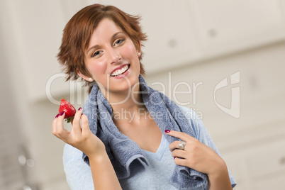 Pretty Red Haired Woman Holding Strawberry