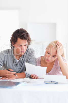 Worried Couple with Paperwork