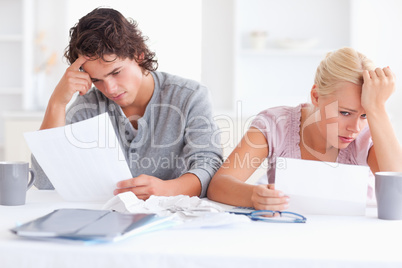 Stressed Couple with Paperwork