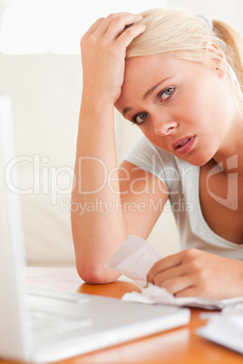 Worried woman doing paperwork