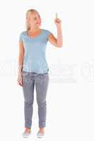 Blond woman pointing at copyspace