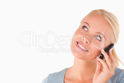 Smiling blond woman on the phone