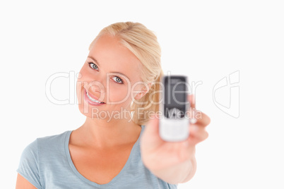 Happy woman showing a mobile