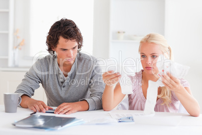 Couple in despair while doing their accounts