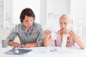 Couple in despair while doing their accounts