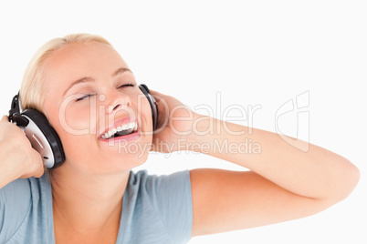 Close up of a laughing woman with headphones