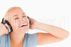 Close up of a laughing woman with headphones