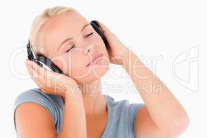 Close up of a blond woman with headphones