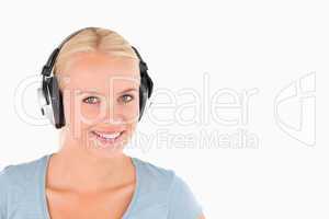 Close up of a smiling woman with headphones