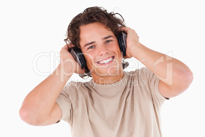 Smiling man with headphones looking into the camera