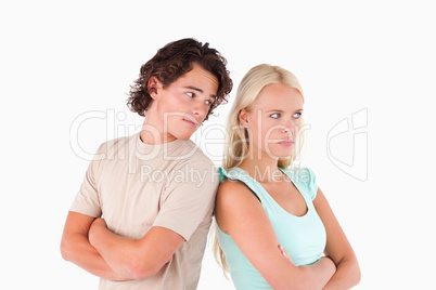 Unhappy couple standing back to back